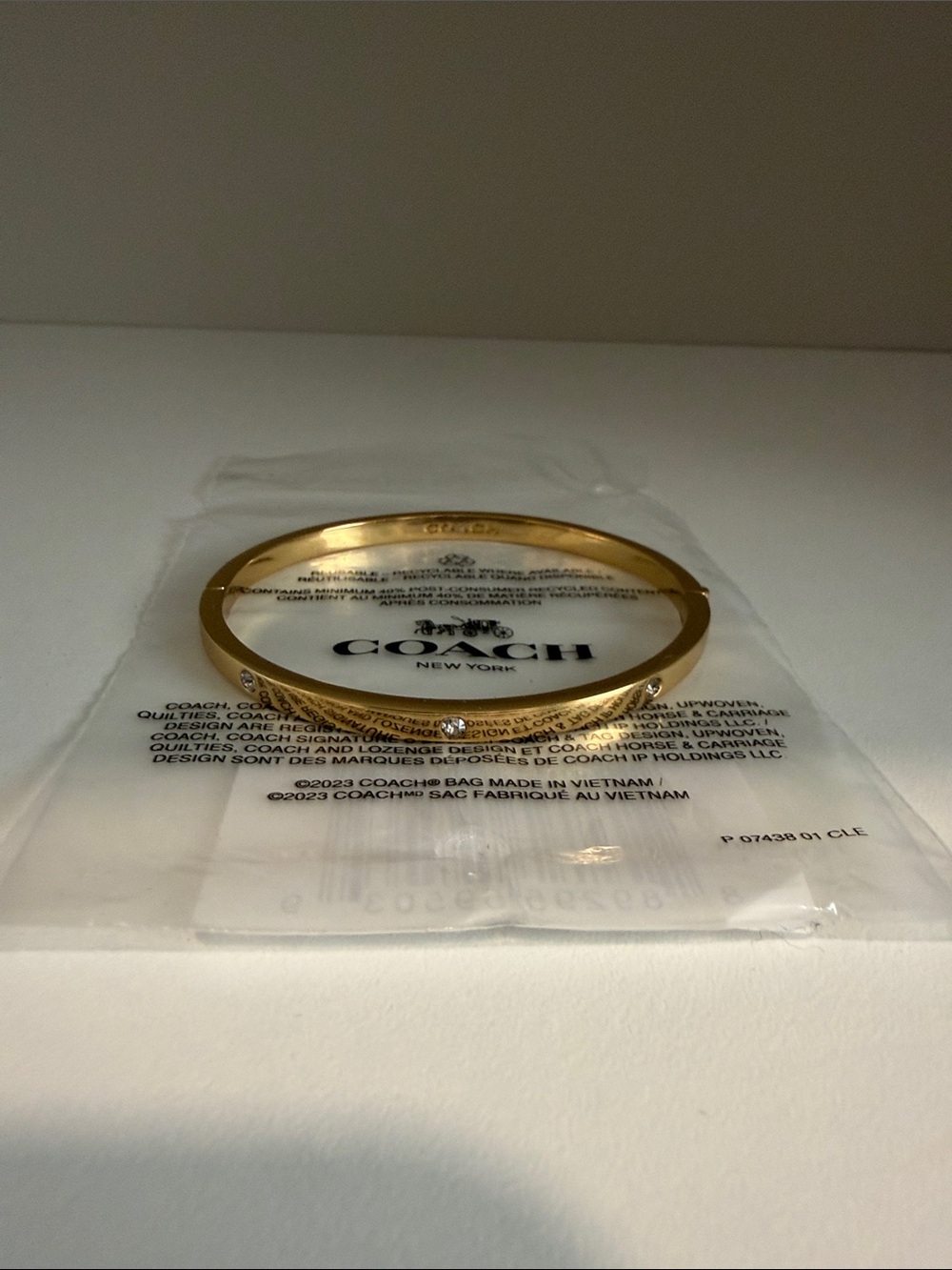 Coach Gold-Tone Slim Engraved Bangle Bracelet